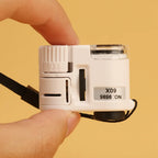 Lupa de Bolsillo 60X con LED – Mini Microscopio Portátil para Joyas, Divisas e Inspección de Precisión
